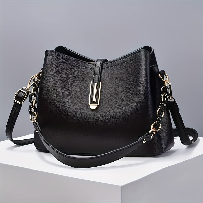 Elegant black crossbody bag with adjustable strap and gold hardware