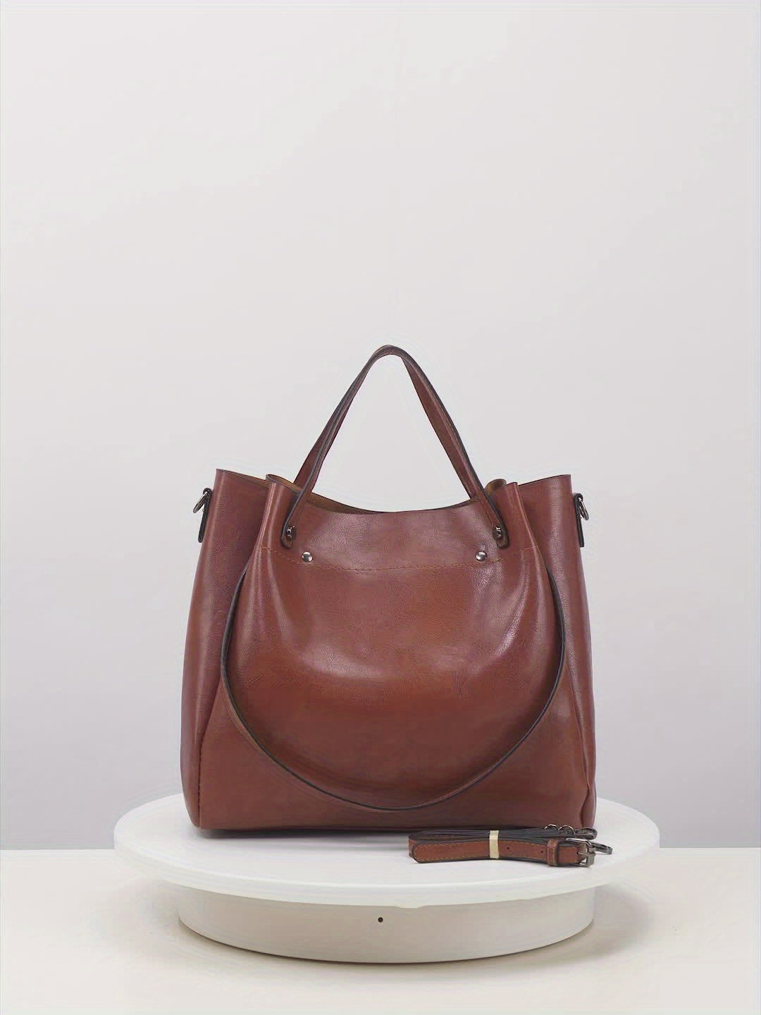 Stylish oil handbag with retro design for modern commuters.