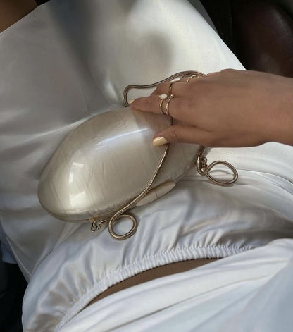 Elegant evening clutch with satin finish and gold clasp