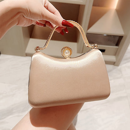 Elegant peach evening clutch with golden accents for weddings