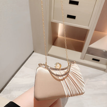 Elegant peach evening clutch with golden accents for weddings