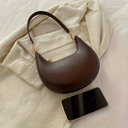 Luxurious women's crescent handbag with adjustable shoulder strap