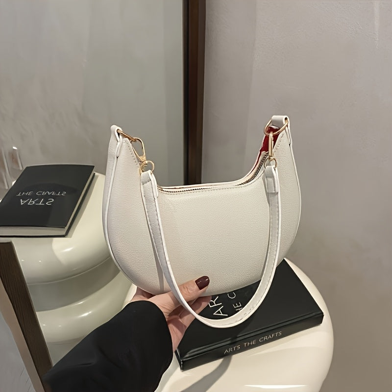 Luxurious women's crescent handbag with adjustable shoulder strap