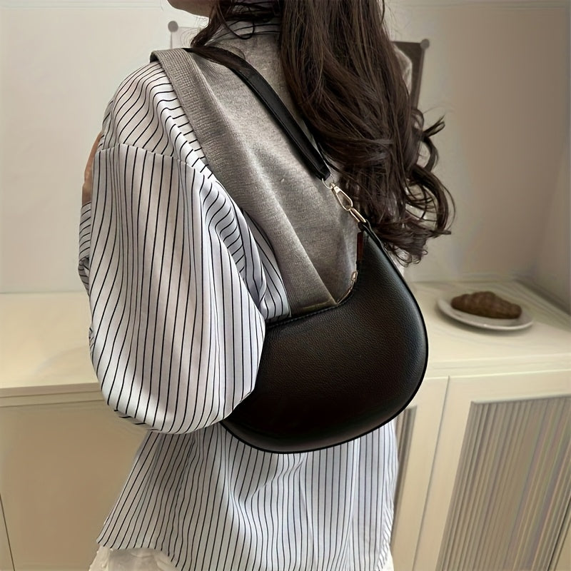 Luxurious women's crescent handbag with adjustable shoulder strap