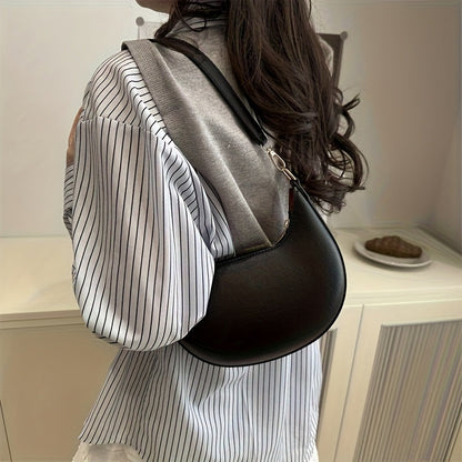 Luxurious women's crescent handbag with adjustable shoulder strap