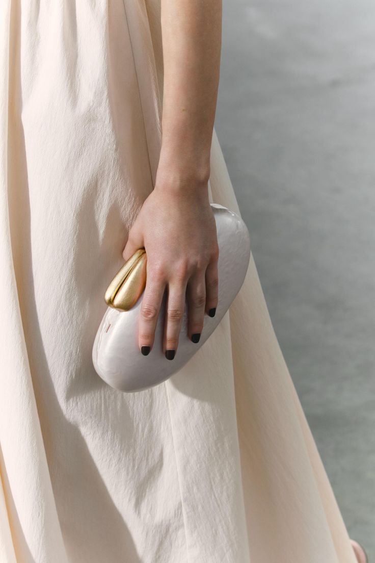 Elegant evening clutch with satin finish and gold clasp