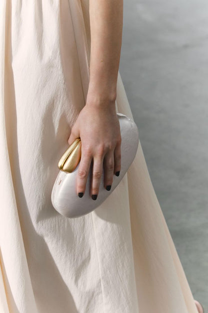 Elegant evening clutch with satin finish and gold clasp