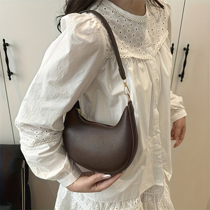 Luxurious women's crescent handbag with adjustable shoulder strap