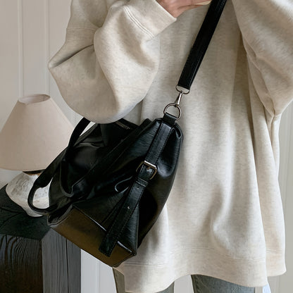 Spacious Black PU Tote Bag with Adjustable Strap and Compartments