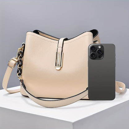 Elegant black crossbody bag with adjustable strap and gold hardware